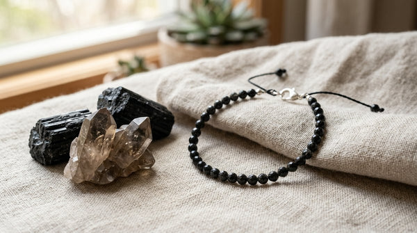 Black tourmaline bracelet with grounding crystals on linen in soft natural light