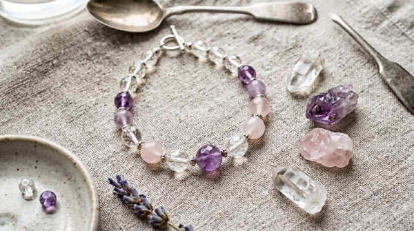 Photorealistic crystal bead bracelet with amethyst, rose quartz, and clear quartz on linen