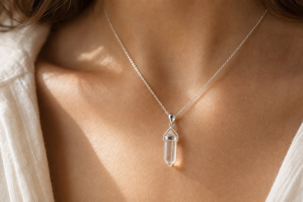 Sterling silver crystal pendant necklace on bare skin, hypoallergenic jewelry for sensitive skin