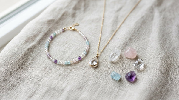 Crystal jewelry flat lay with gemstone bracelet and pendant necklace