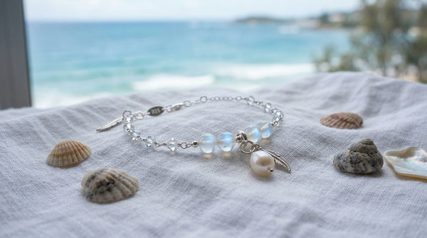 Moonstone and pearl crystal bracelet in soft ocean-blue setting