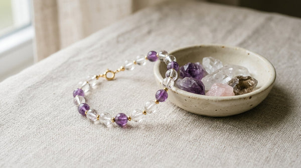 Crystal bead bracelet beside small bowl of raw crystals